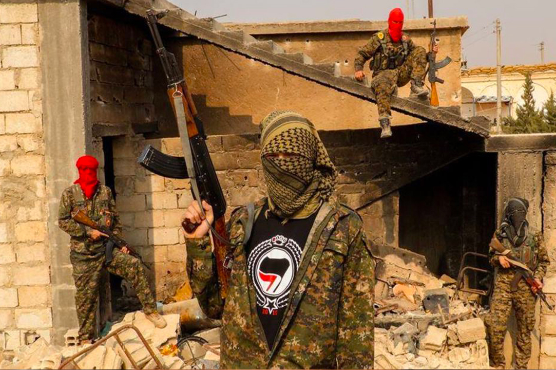Above, various Antifascist revolutionaries are pictured amidst one of many battles against Da`esh - to so-called Islamic State